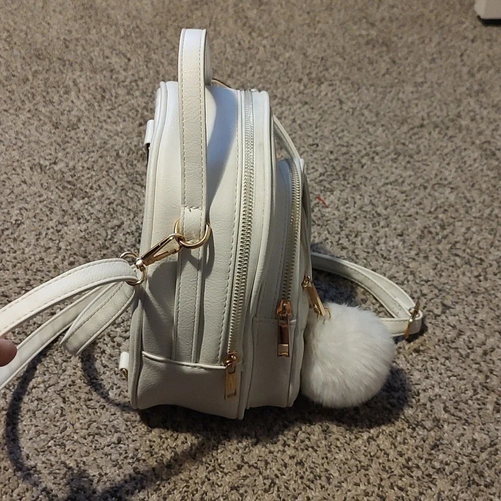 Girls white backpack with Pom